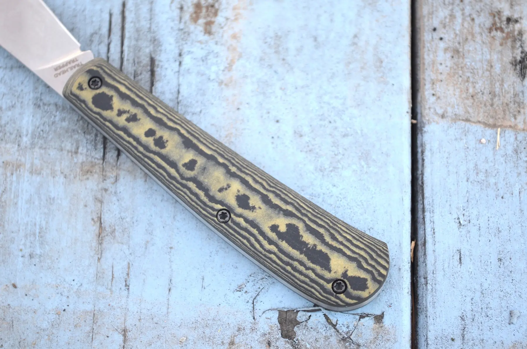 A close-up of the Trailhead Trapper’s handle