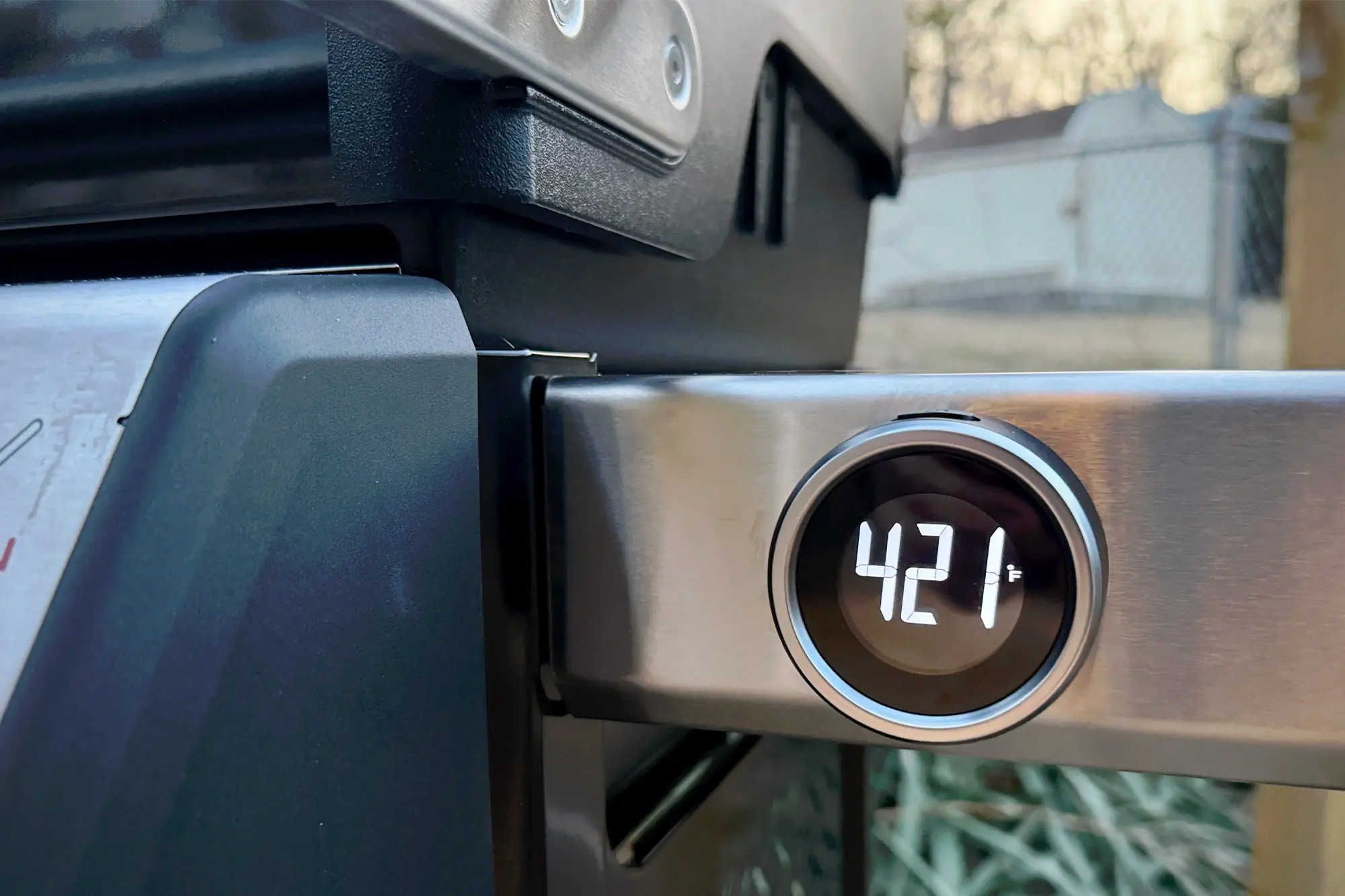 Close-up of the Weber Spirit Propane Grill's digital thermometer showing 421 degrees Fahrenheit