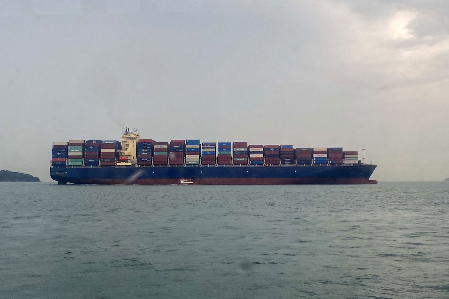 Cargo ship at sea carrying containers