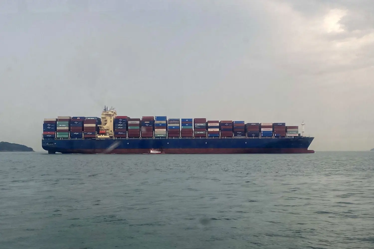 Cargo ship at sea carrying containers