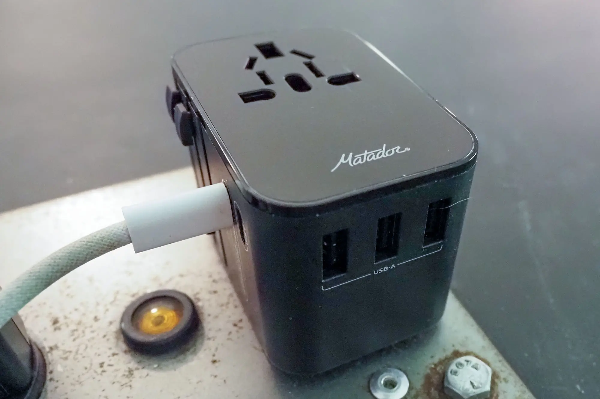 matador global travel adapter plugged in