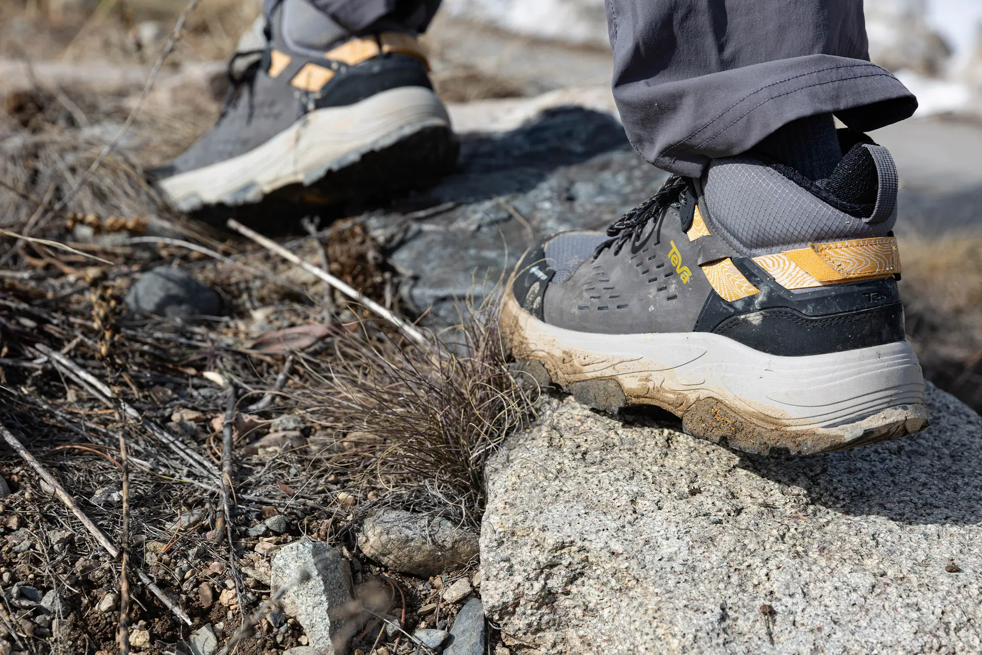 Teva Grandview Max GTX hiking boot stepping on rocky trail terrain