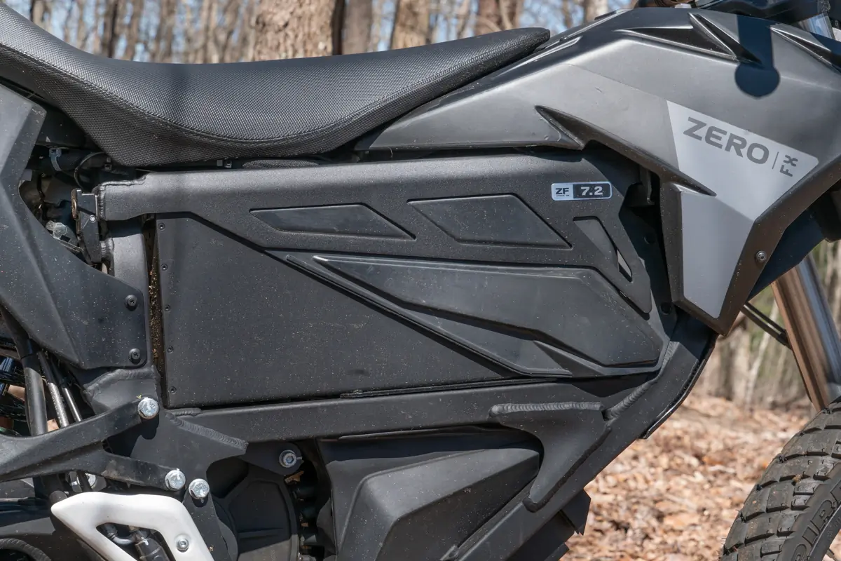 A close-up of the Zero FX electric motorcycle's battery panel, showing the ZF 7.2 label and sleek design