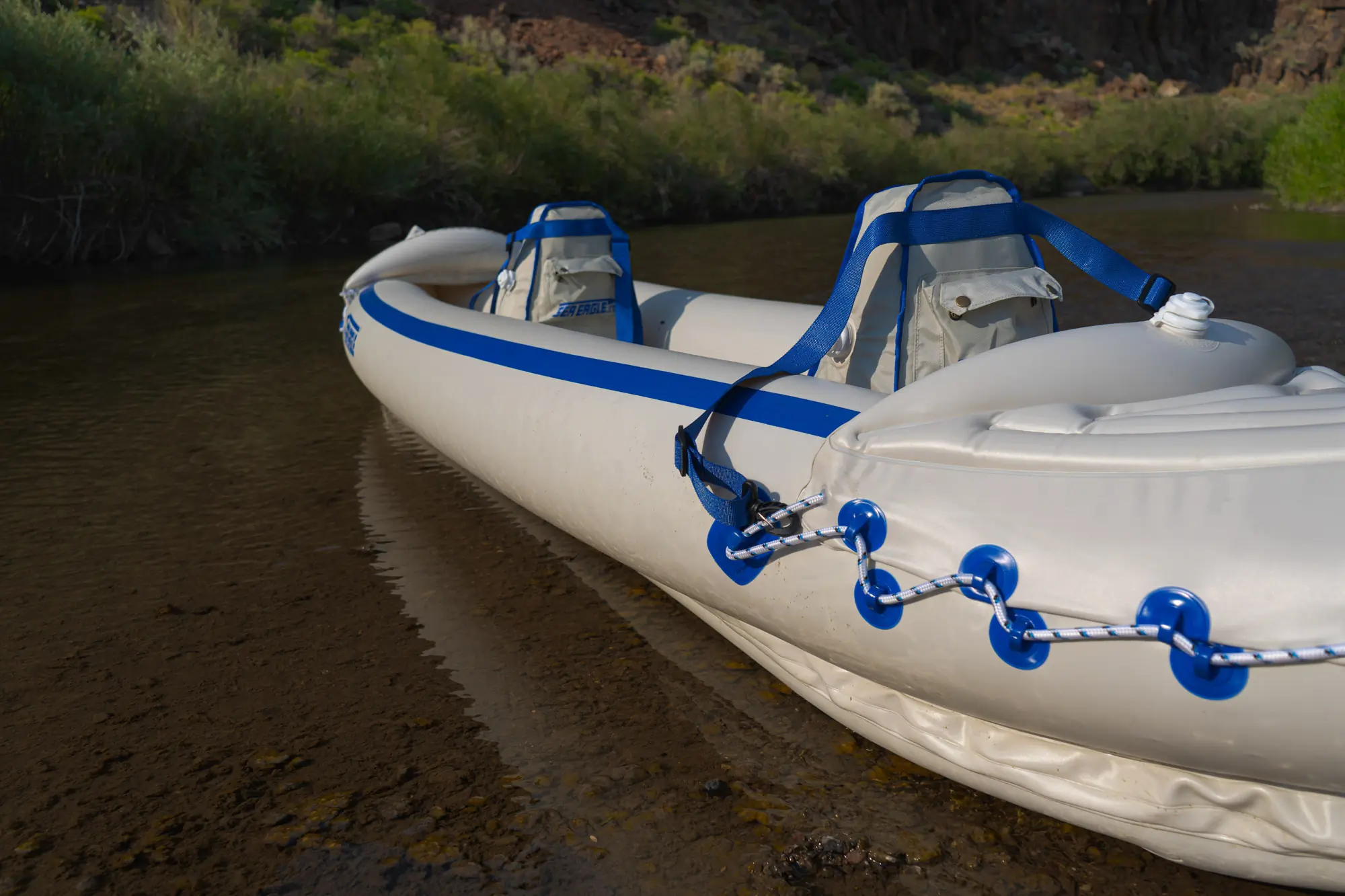 The Sea Eagle SE370 kayak beached on shore in an Nevada river