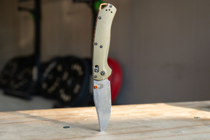 Benchmade Taggedout-OD Green G10 knife on a table