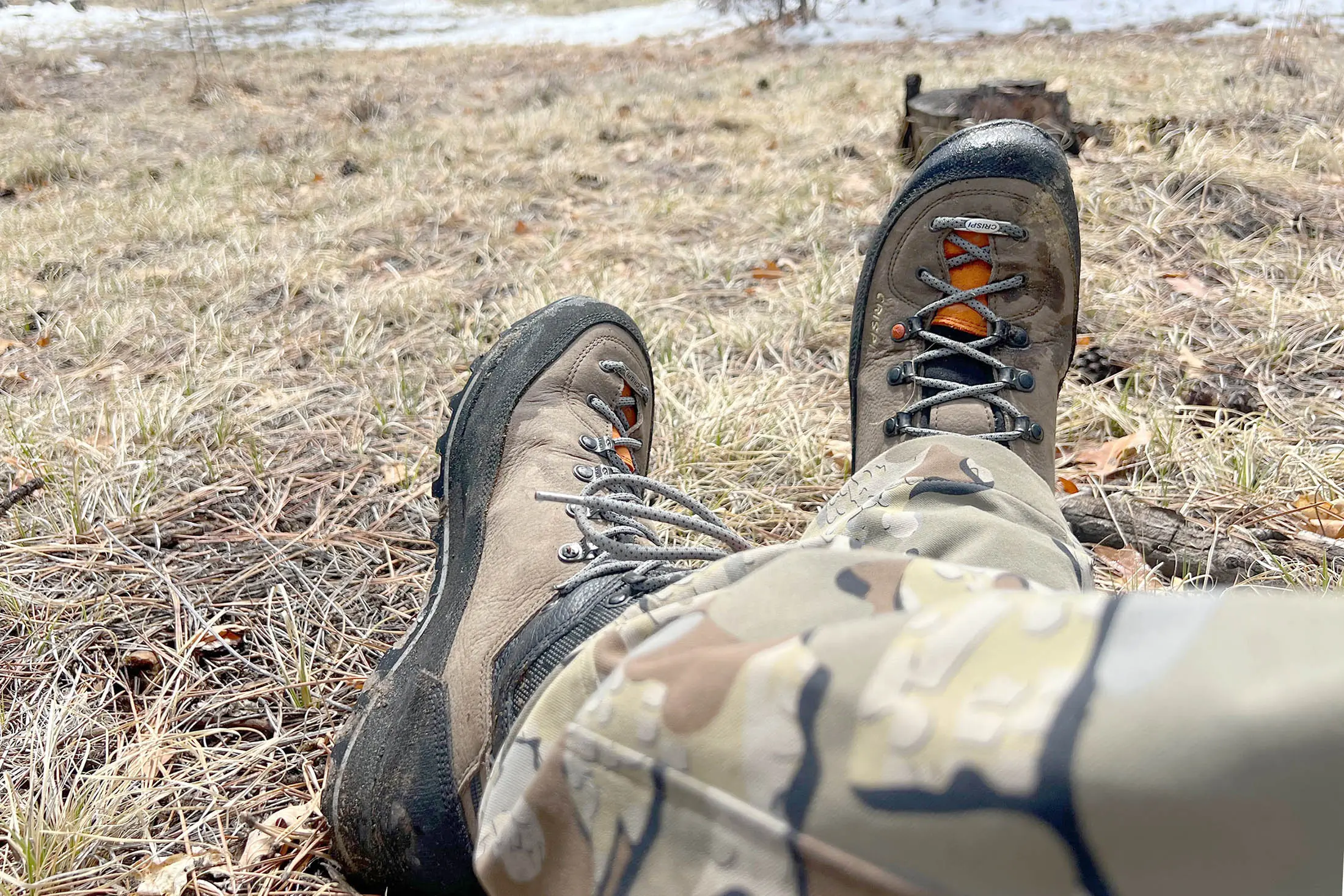 Crispi Lapponia III hunting boots and camouflage in a meadow