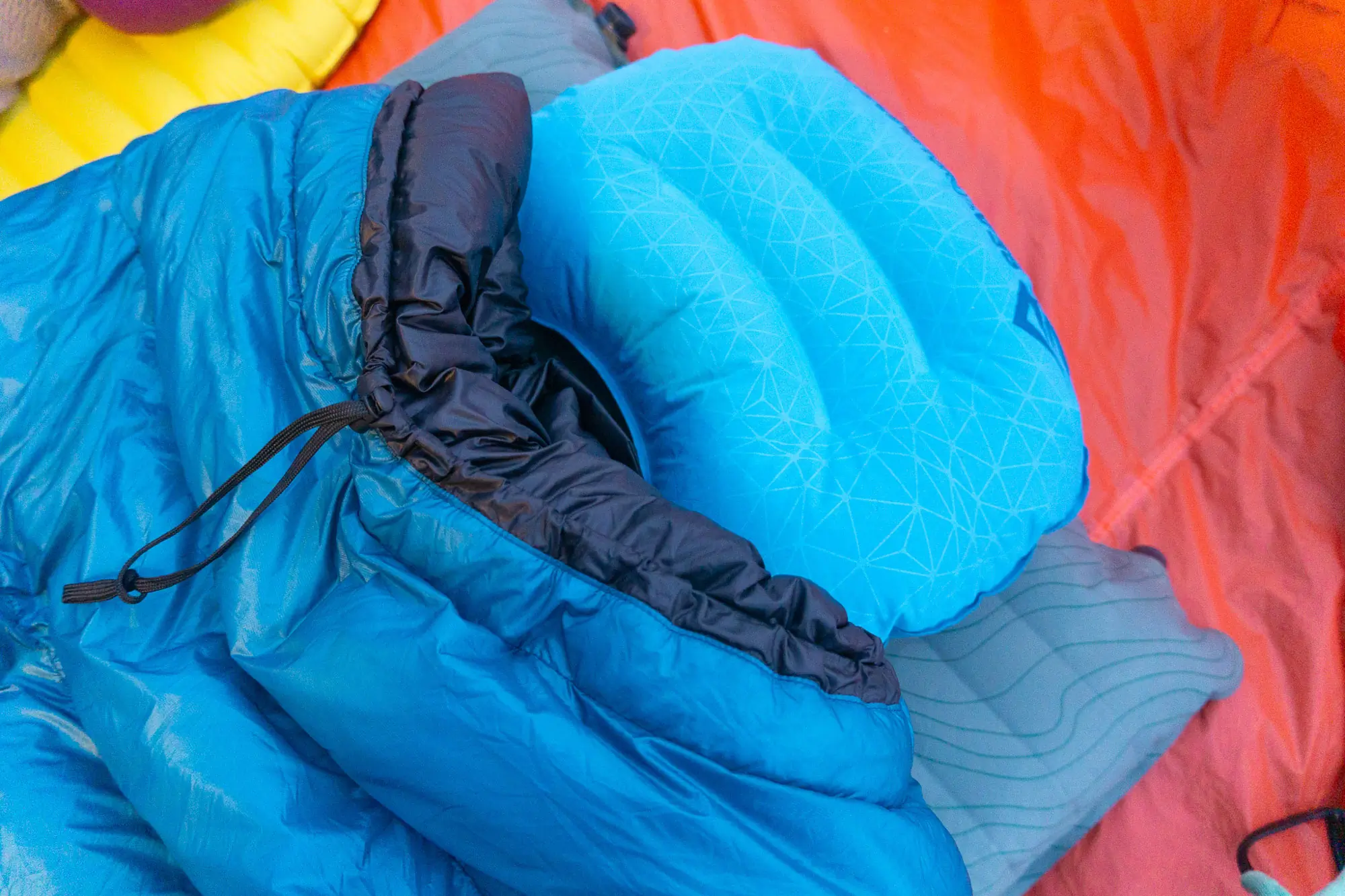 the hoodless katabatic alsek set on a pad with a backpacking pillow