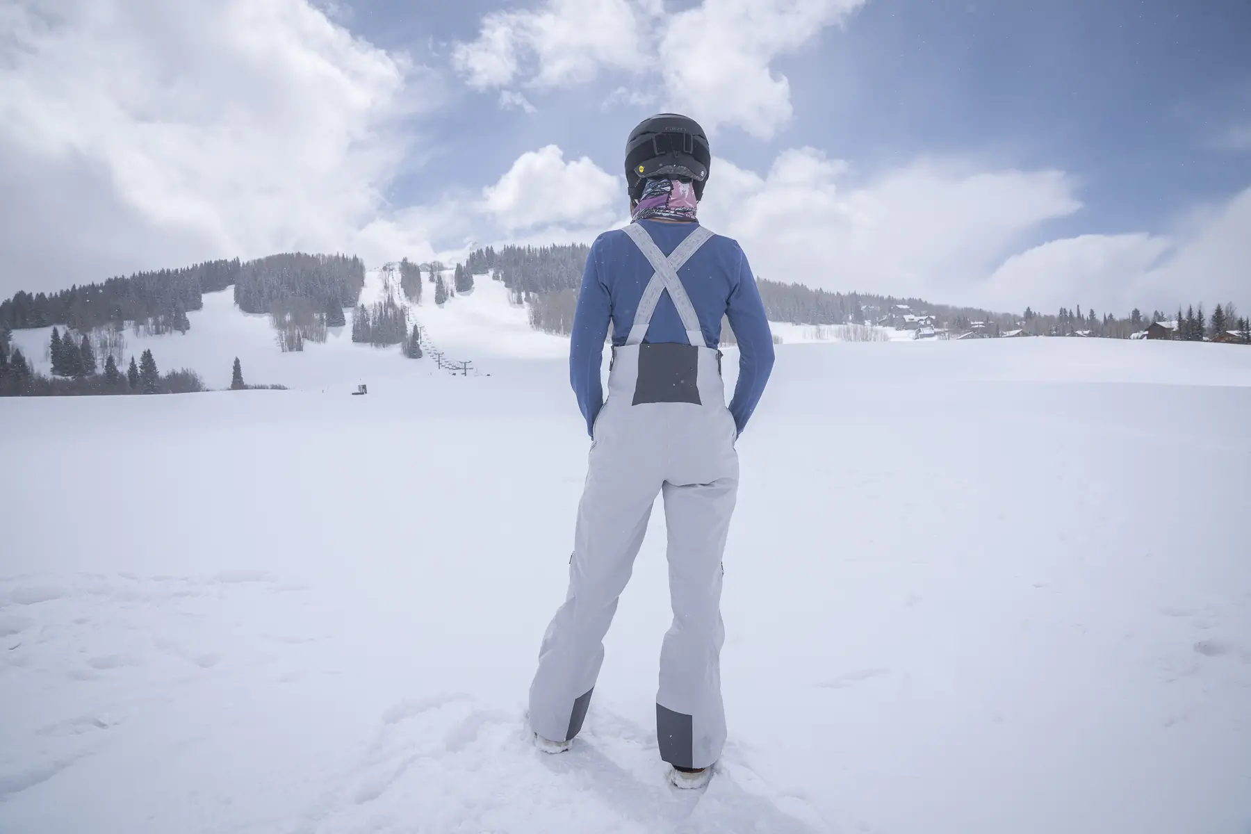 Woman in ski bibs