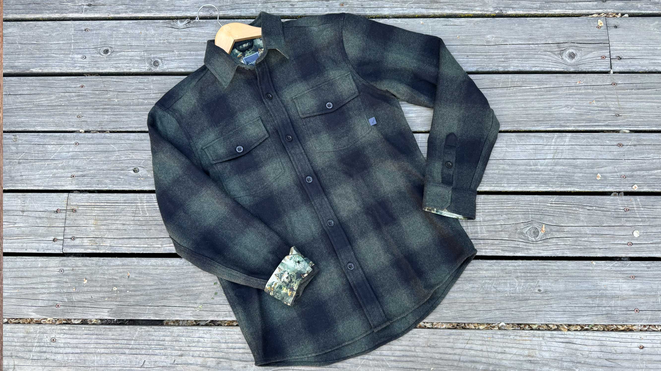 the pladra workhorse wool flannel laid out on a wooden deck