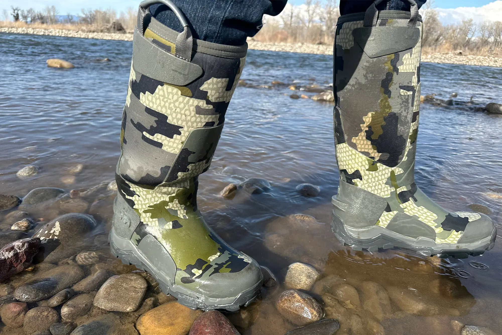 KUIU HD Mud Boot standing in shallow river water