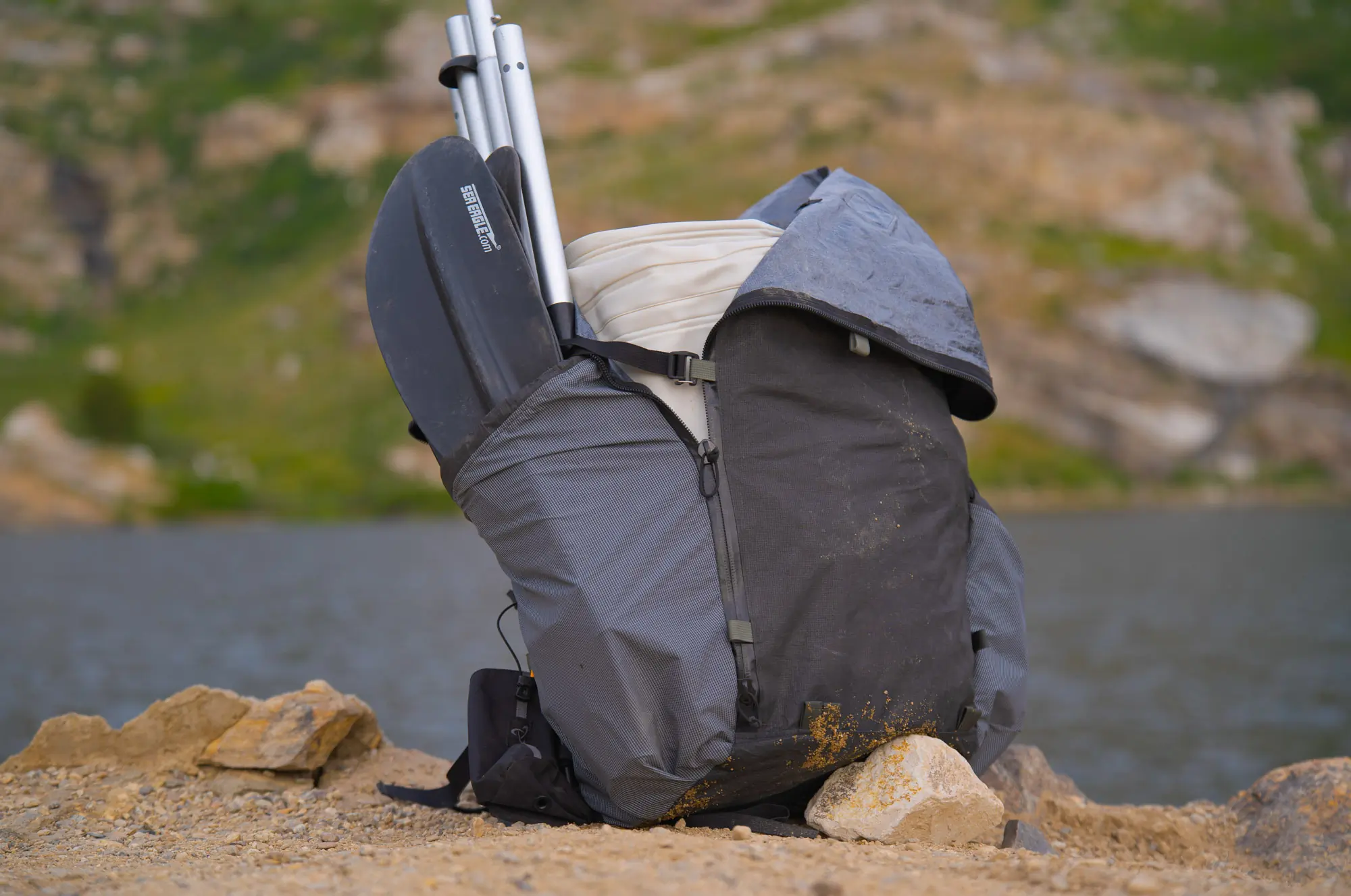 the sea eagle se370 packed into a large backpack along with the paddle