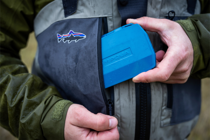 Patagonia Swiftcurrent Traverse Waders with a blue Umpqua box stored in the chest pocket