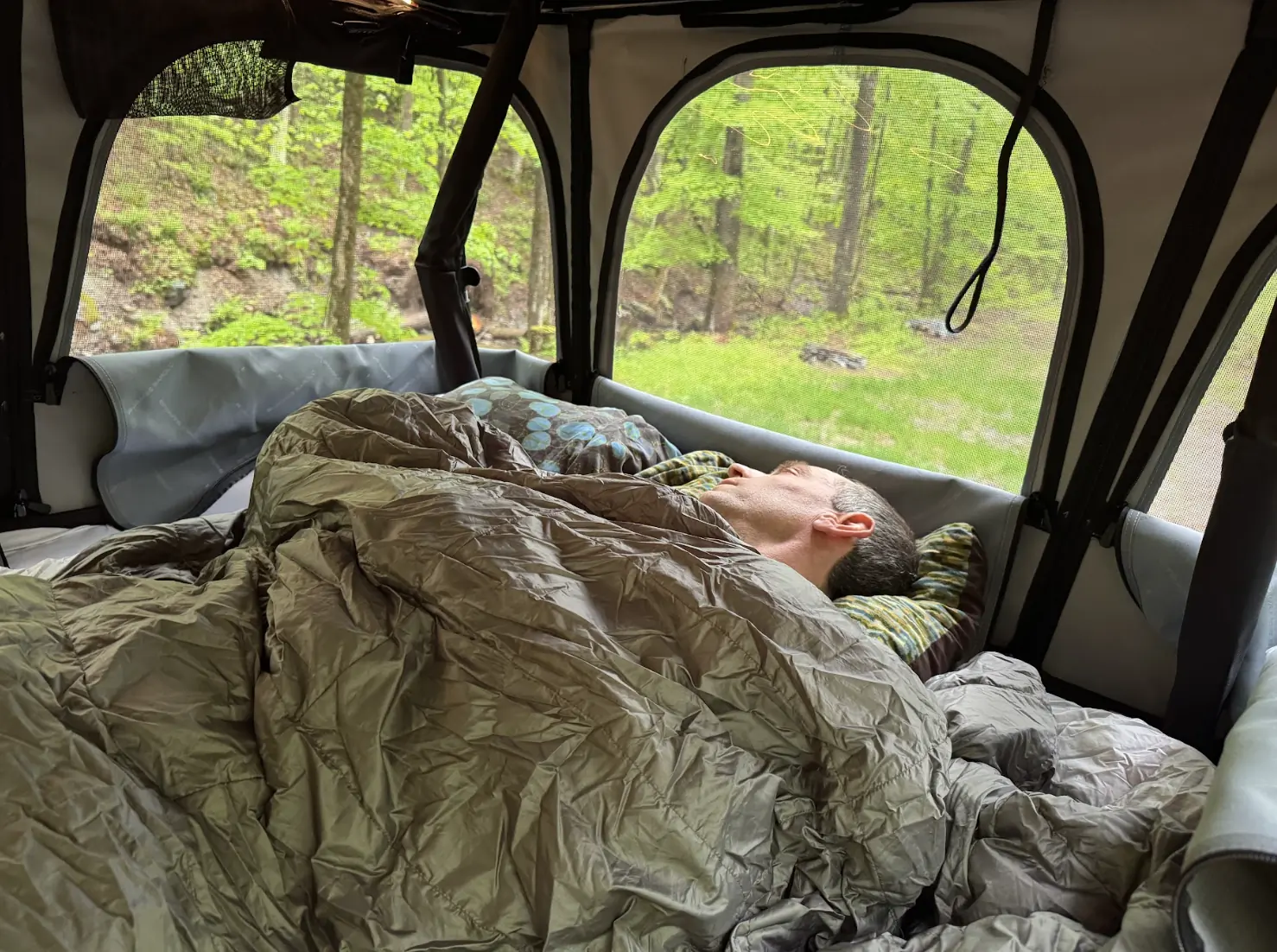 Person sleeping in the James Baroud Odyssey rooftop tent