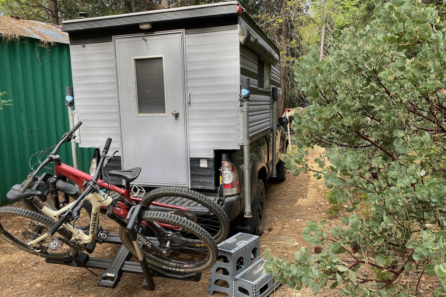 The Thule Verse tilted down with bikes loaded for access to a track camper.