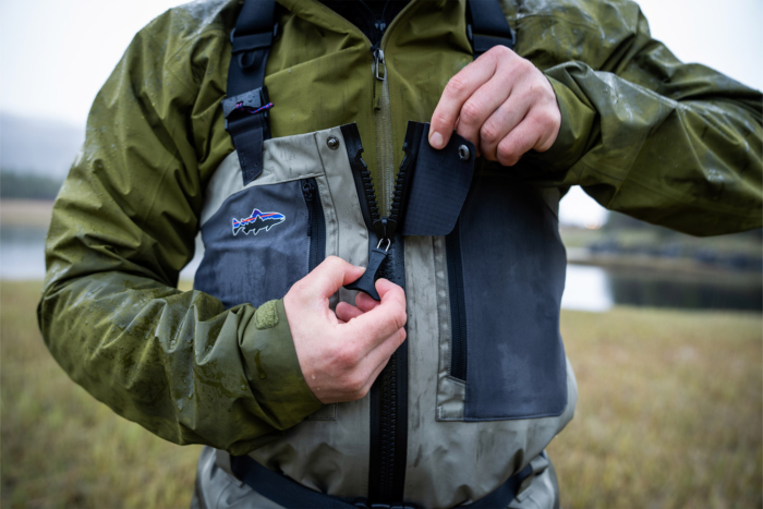 Patagonia Swiftcurrent Traverse Waders shown being zipped up at the chest