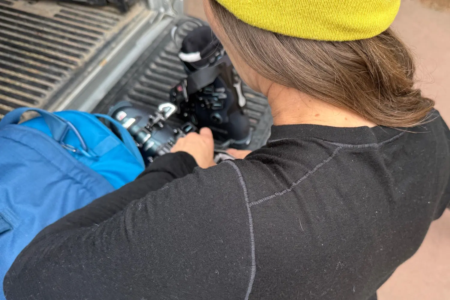A person wearing a black Arc'teryx Satoro crew neck shirt with articulated seams