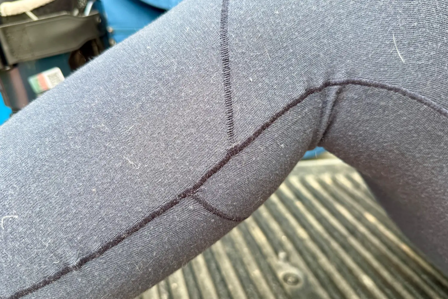 Close-up of Arc'teryx Satoro leggings showing flatlock seams and fabric texture