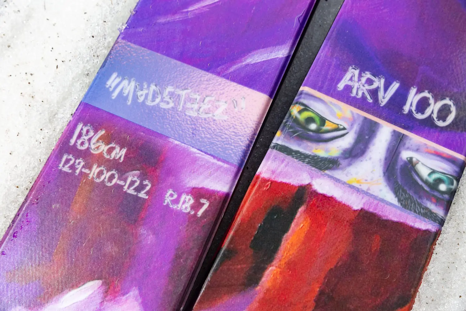 Close-up of the Armada ARV 100 skis showing the topsheet graphics