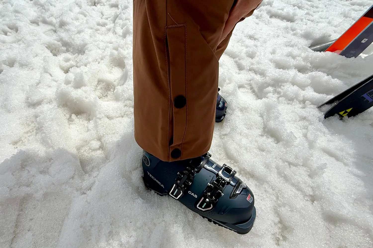 Closeup of exa snow pants showning adjustable leg cuff