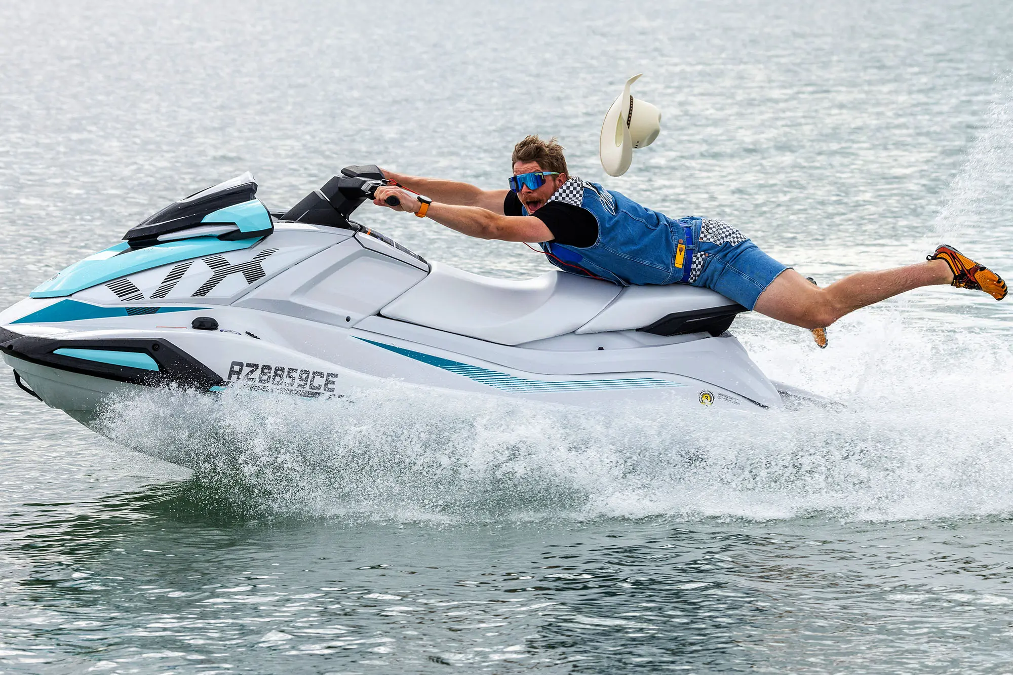 man on jet ski in pit viper wrangler jeans