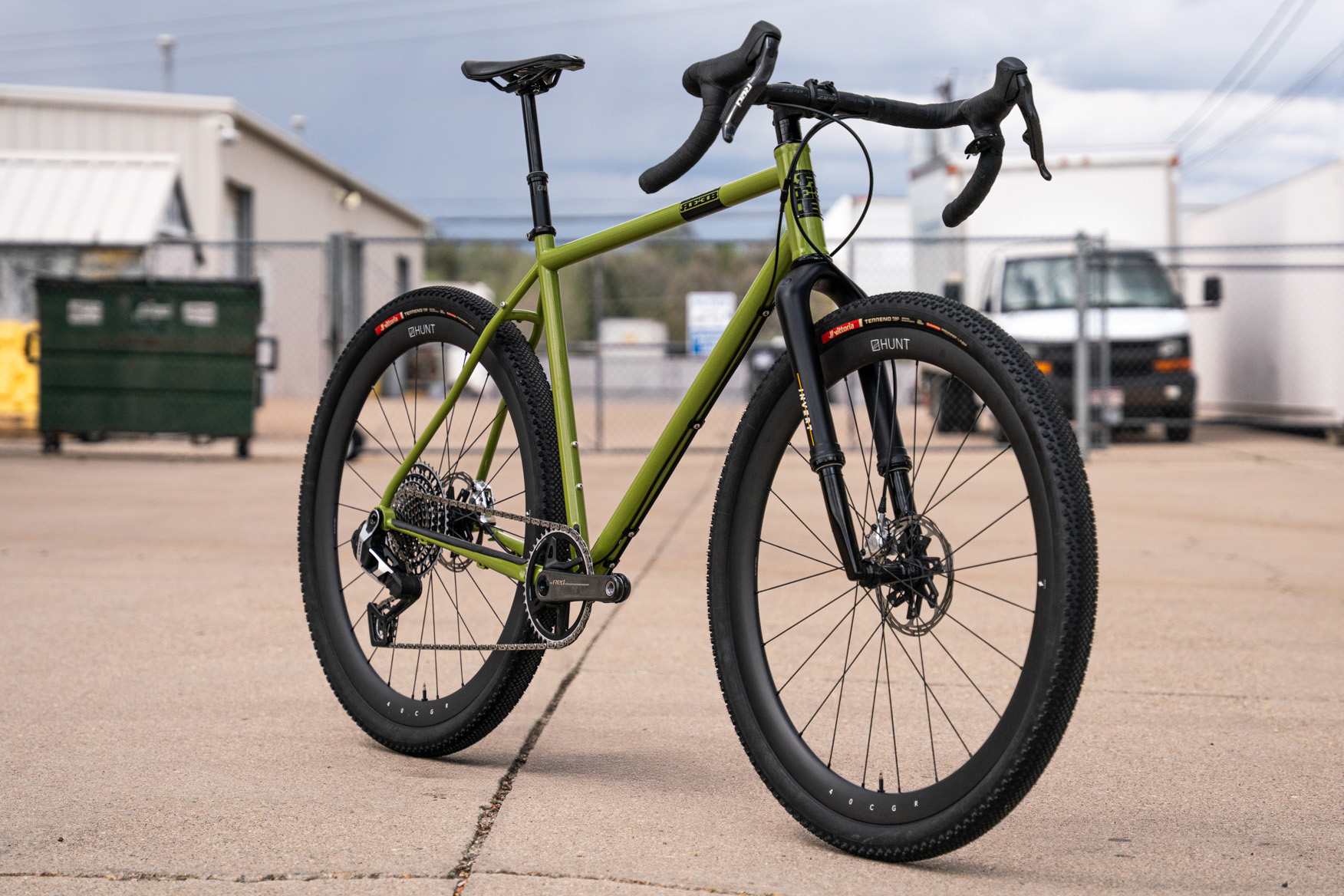 reeb the sams pants gravel bike in parking lot