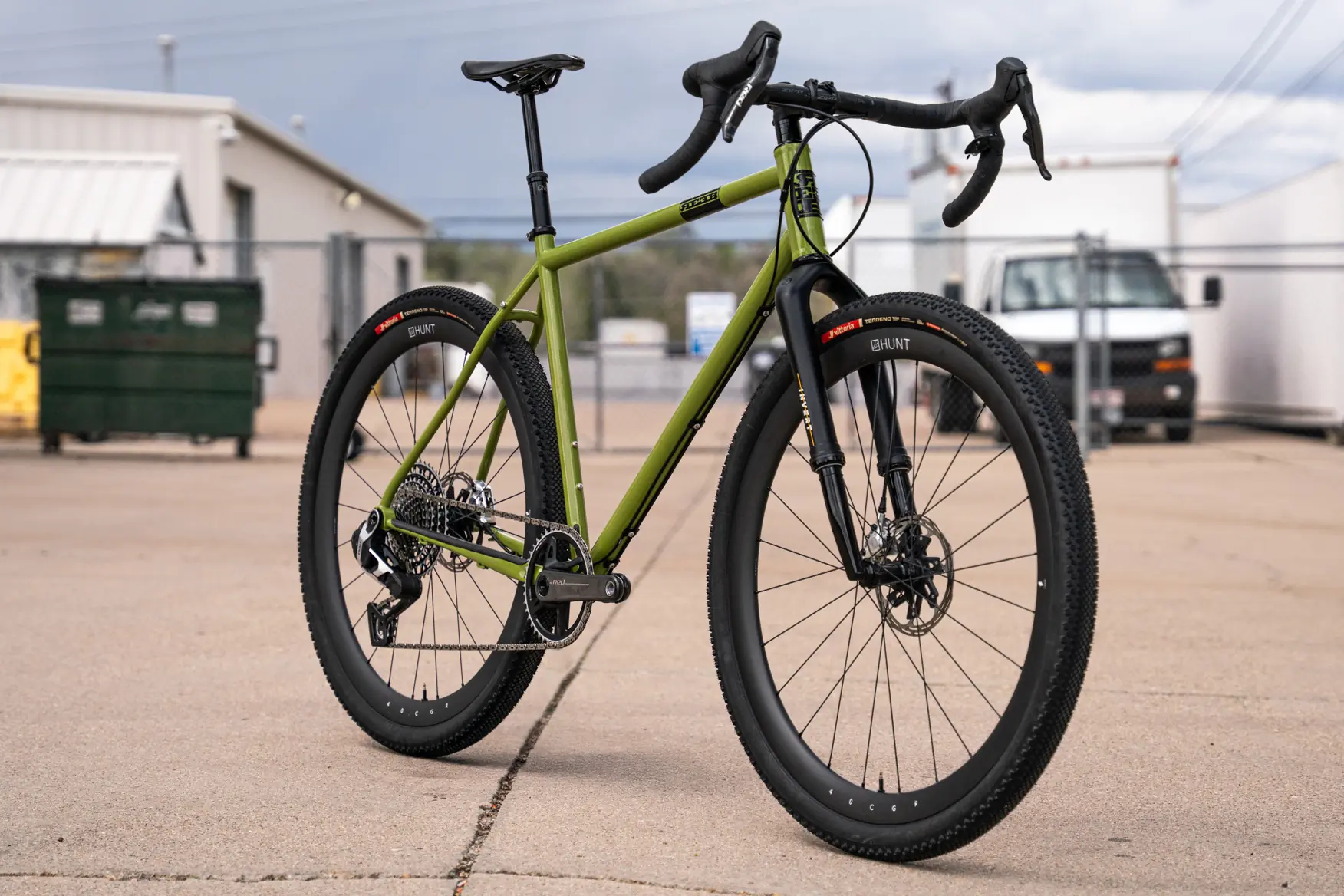 reeb the sams pants gravel bike in parking lot