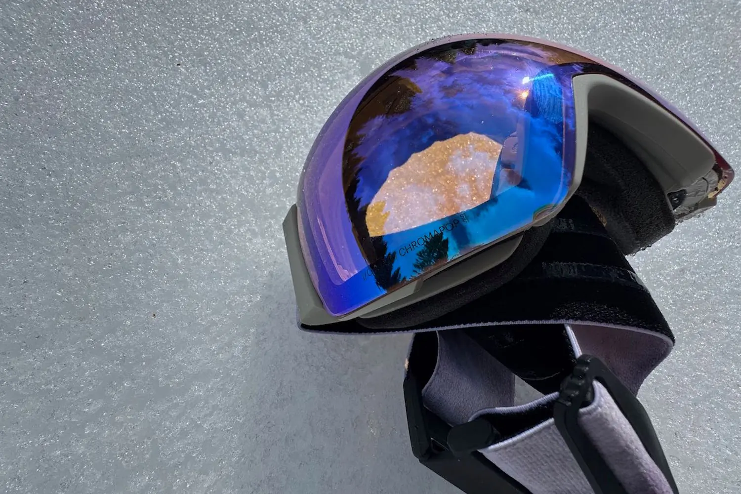 Smith I/O Mag goggles placed on snowy ground