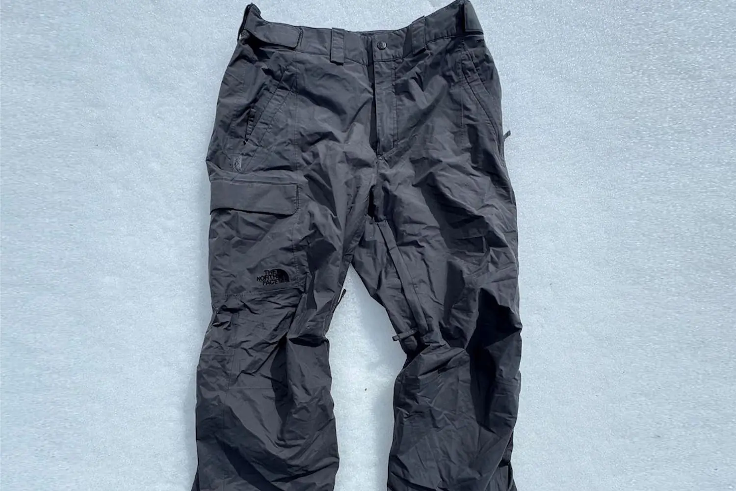 TNF Freedom pants lying on snow