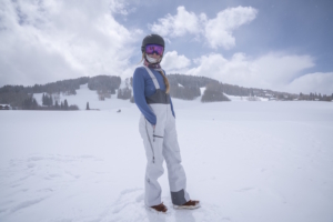 Women wearing stio environ bib standing in snow
