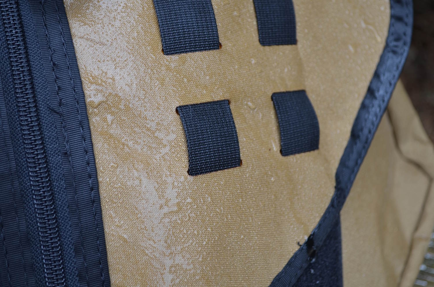 Water beading on the surface of the Transit Bag.