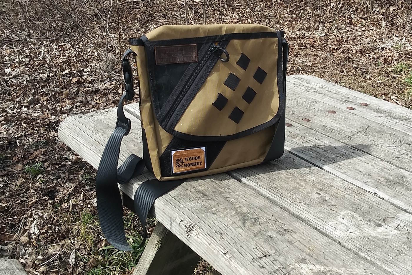 Transit Bag sitting on a picnic table.