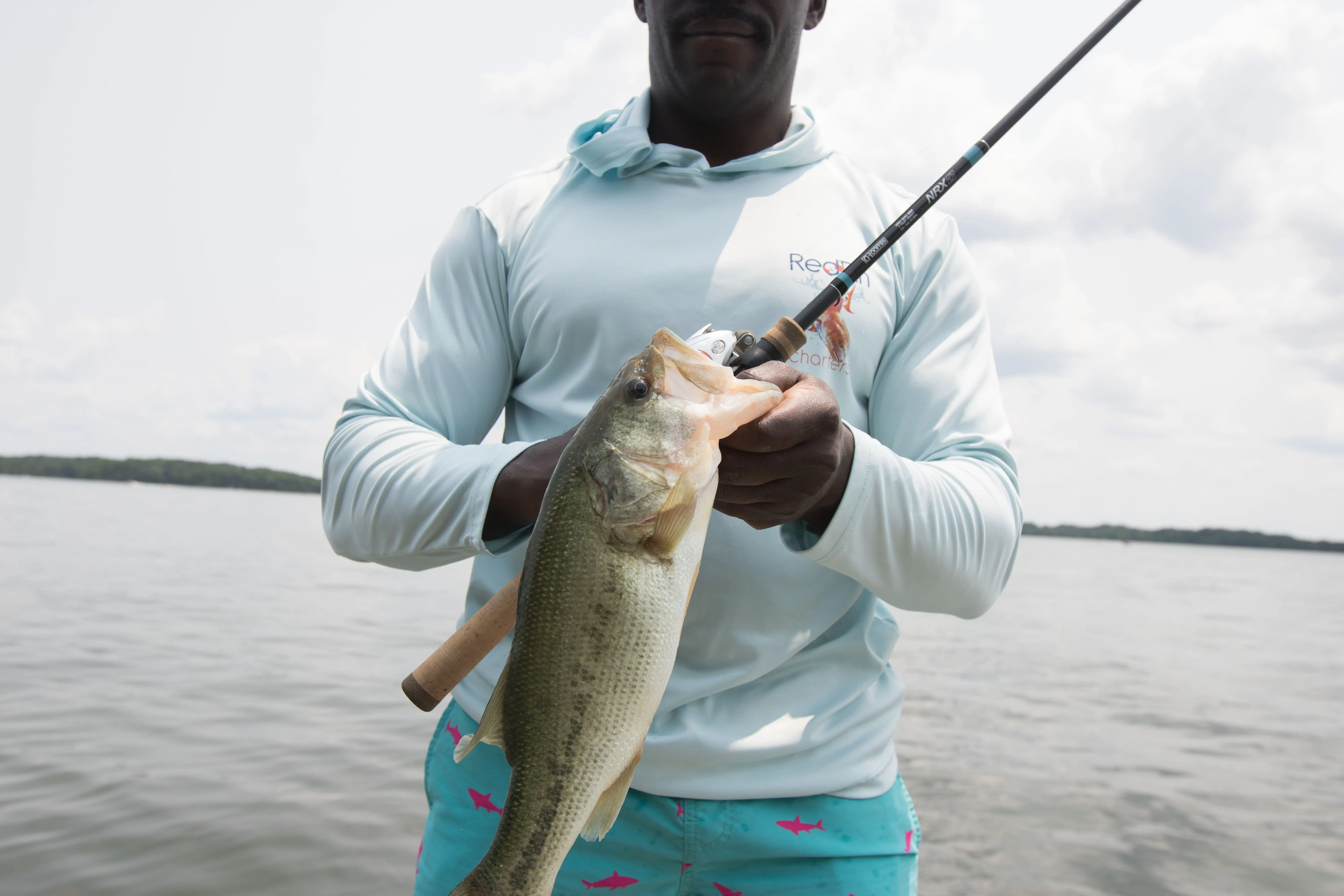 A bass being held next to the G.Loomis NRX+