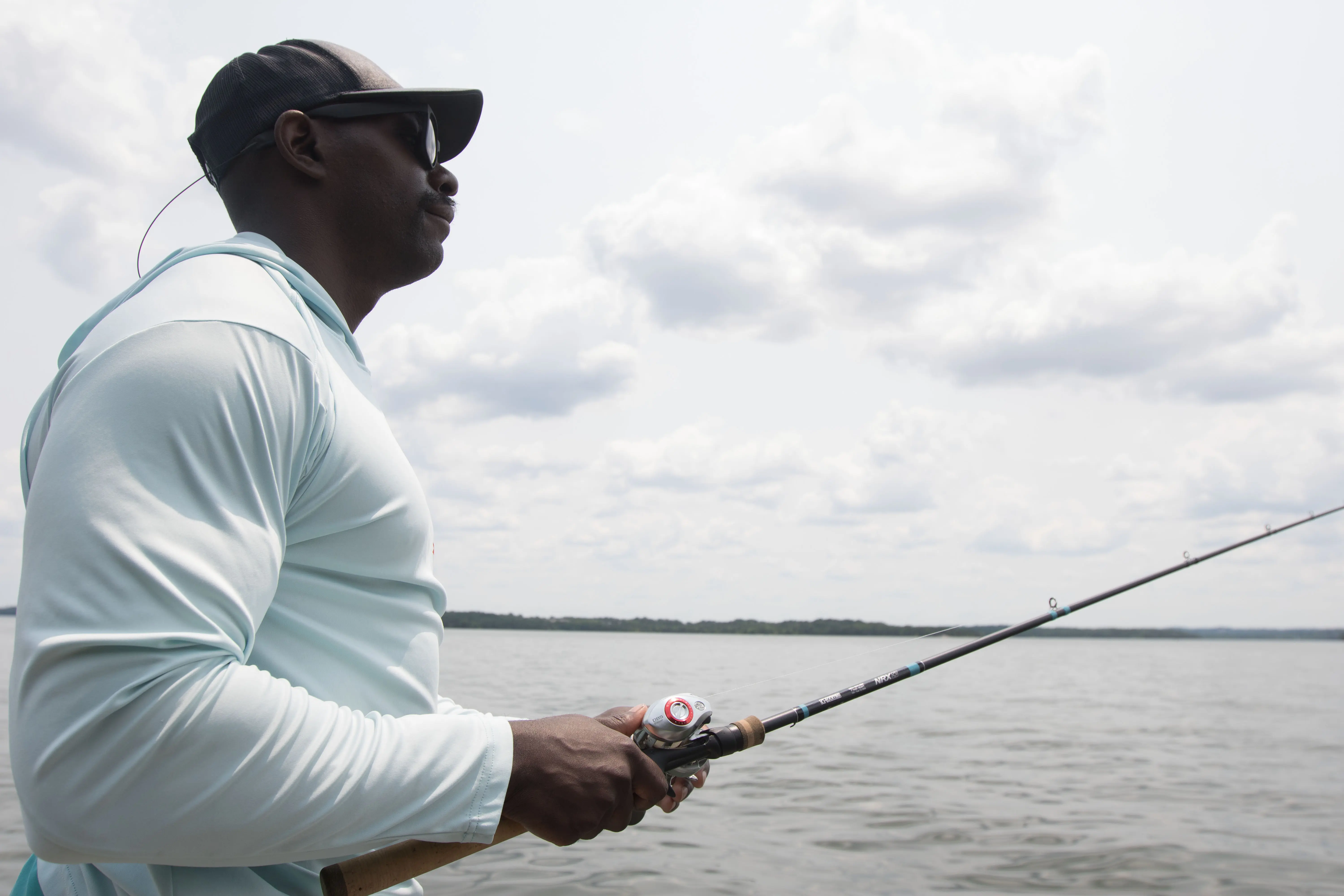 An angler jig fishing with the G. Loomis NRX+