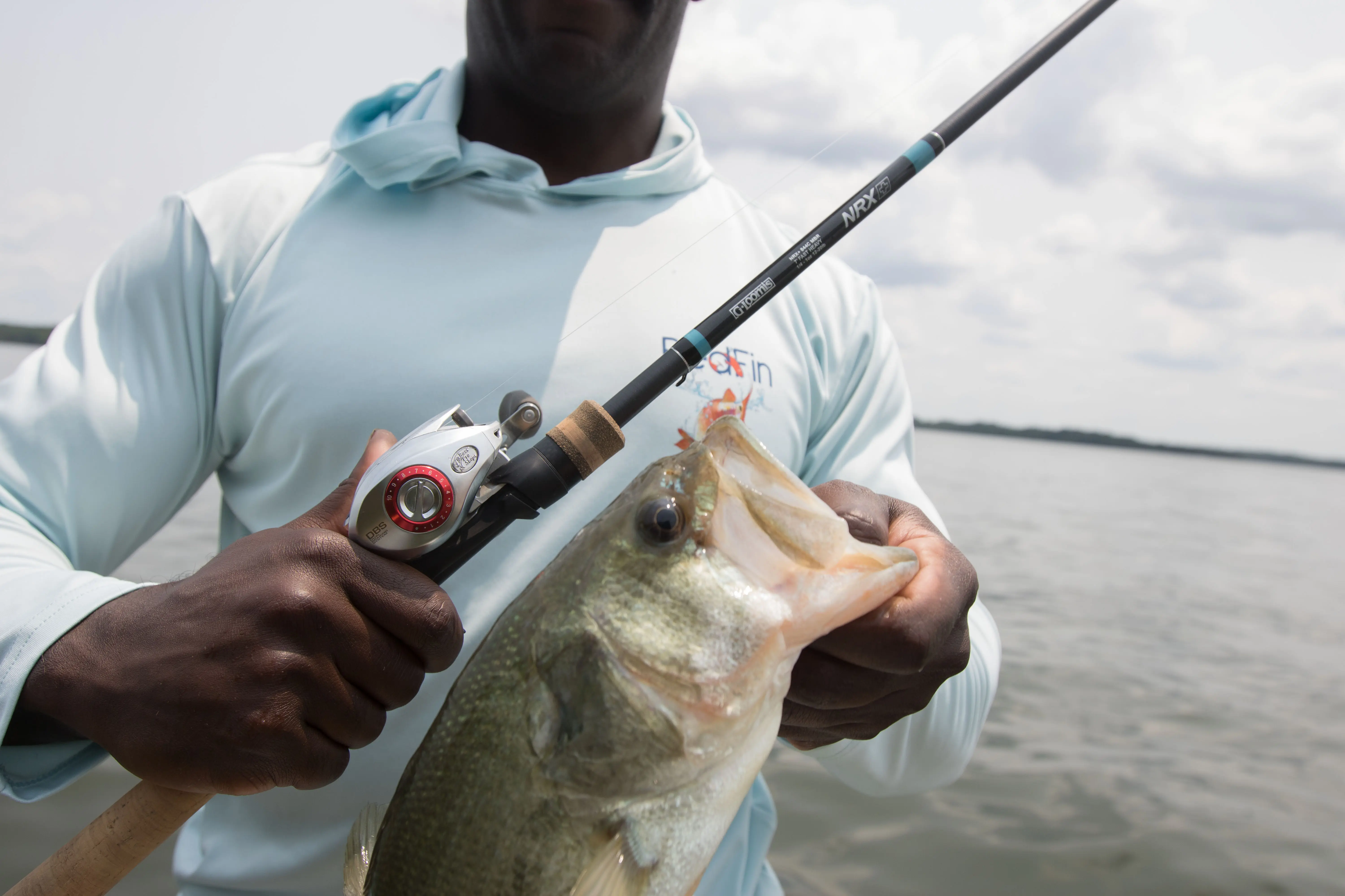 The G. Loomis NRX+ fishing rod next to a bass