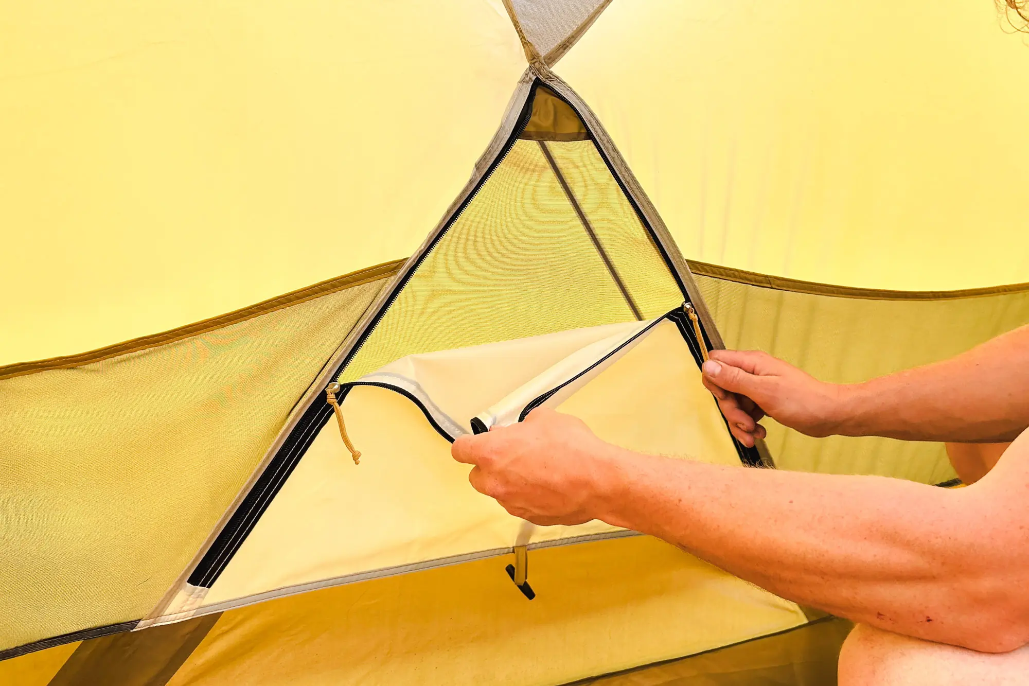 the author opens a vented window in the base camp 6 tent
