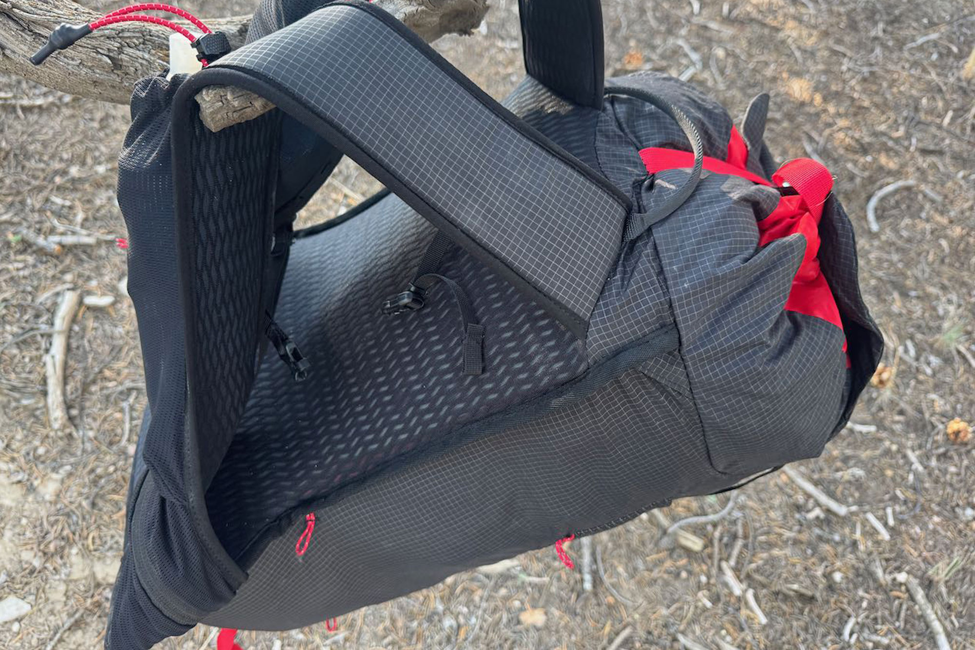 Millet’s new Trilogy Sky 25+ backpack hanging on a tree