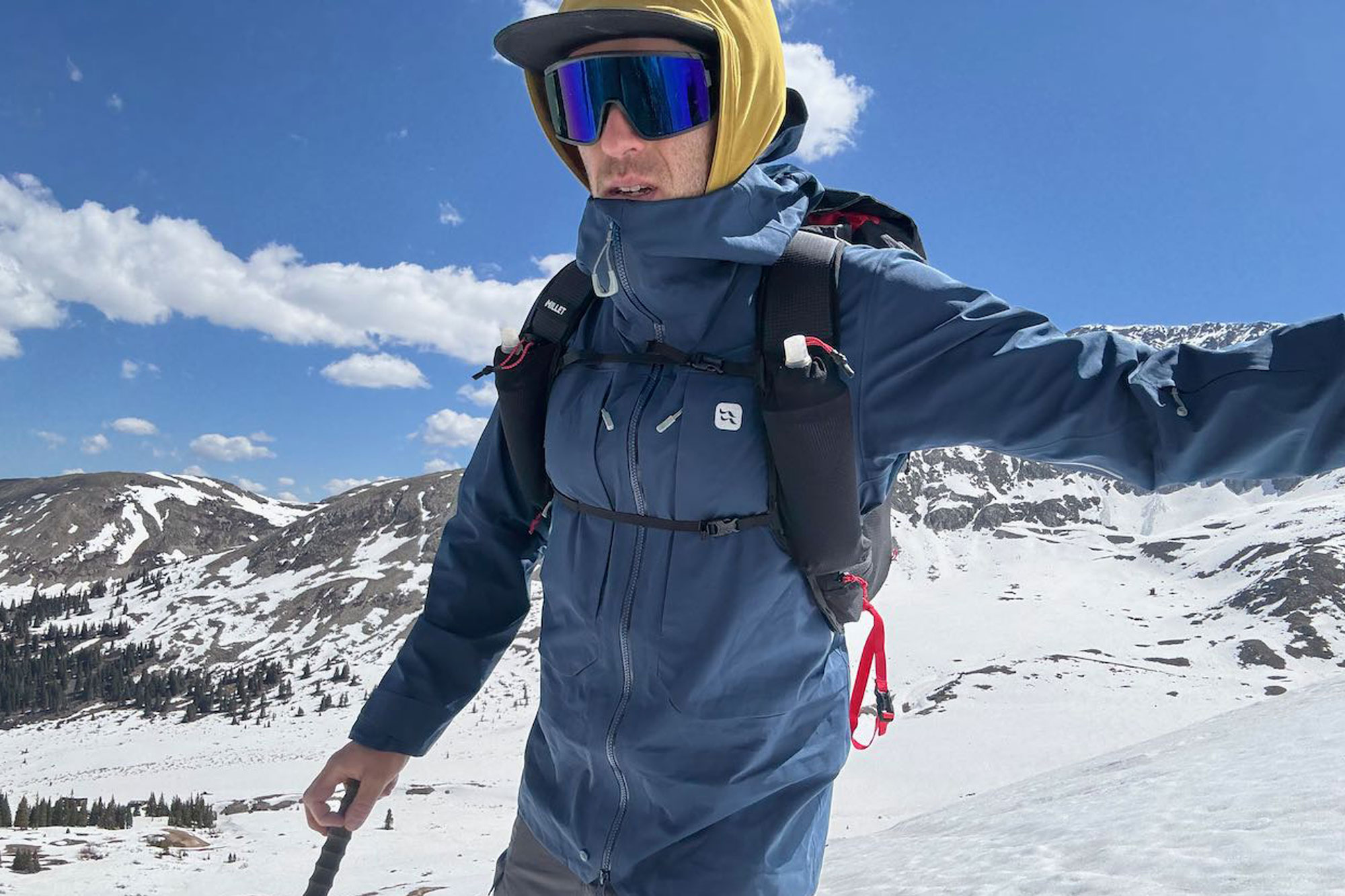 a man skiing with Millet’s new Trilogy Sky 25+ backpack on his back