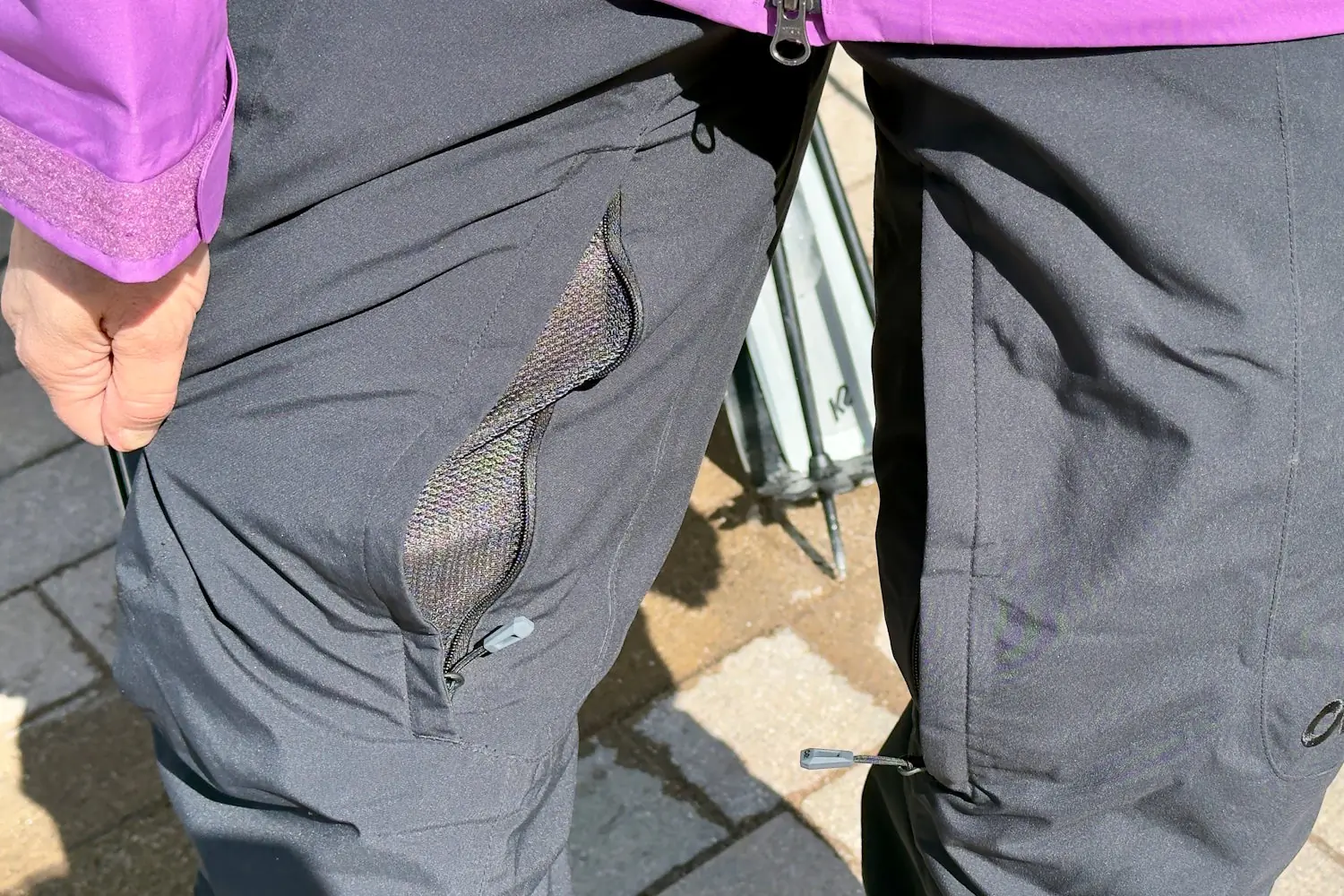 Close-up of OR Snowcrew pants with a partially unzipped mesh-lined thigh vent