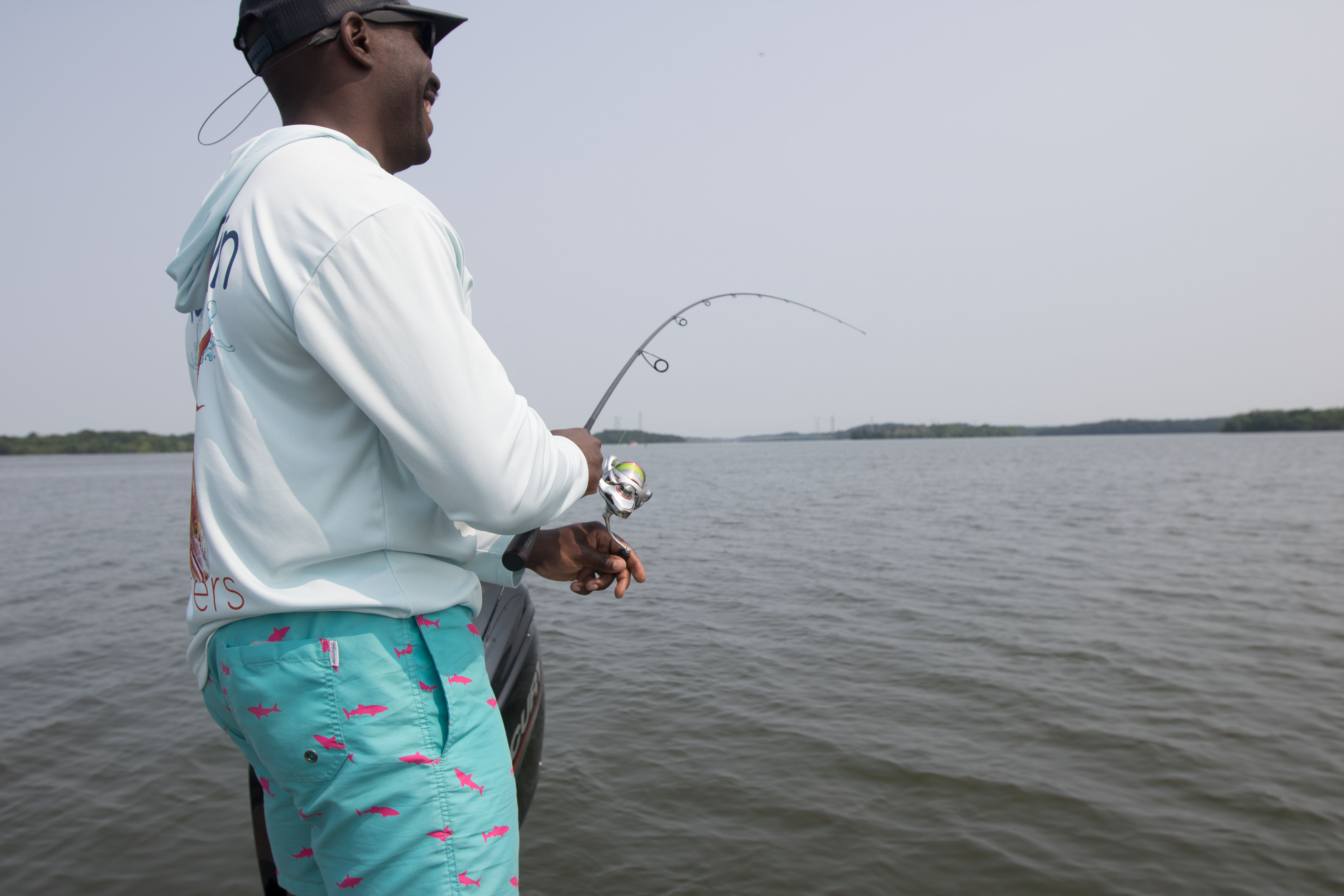 An angler reeling in a fish.