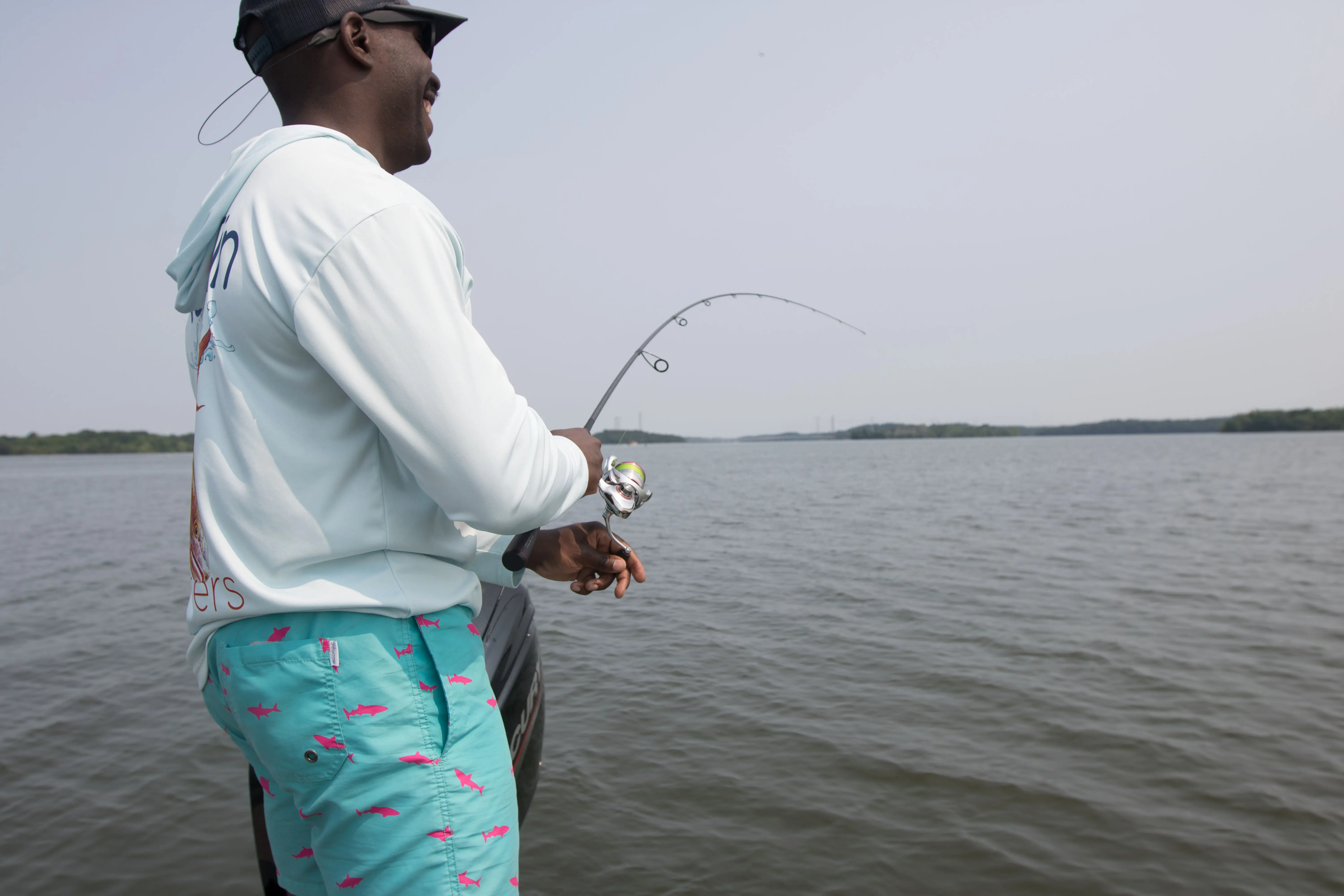 An angler reeling in a fish.