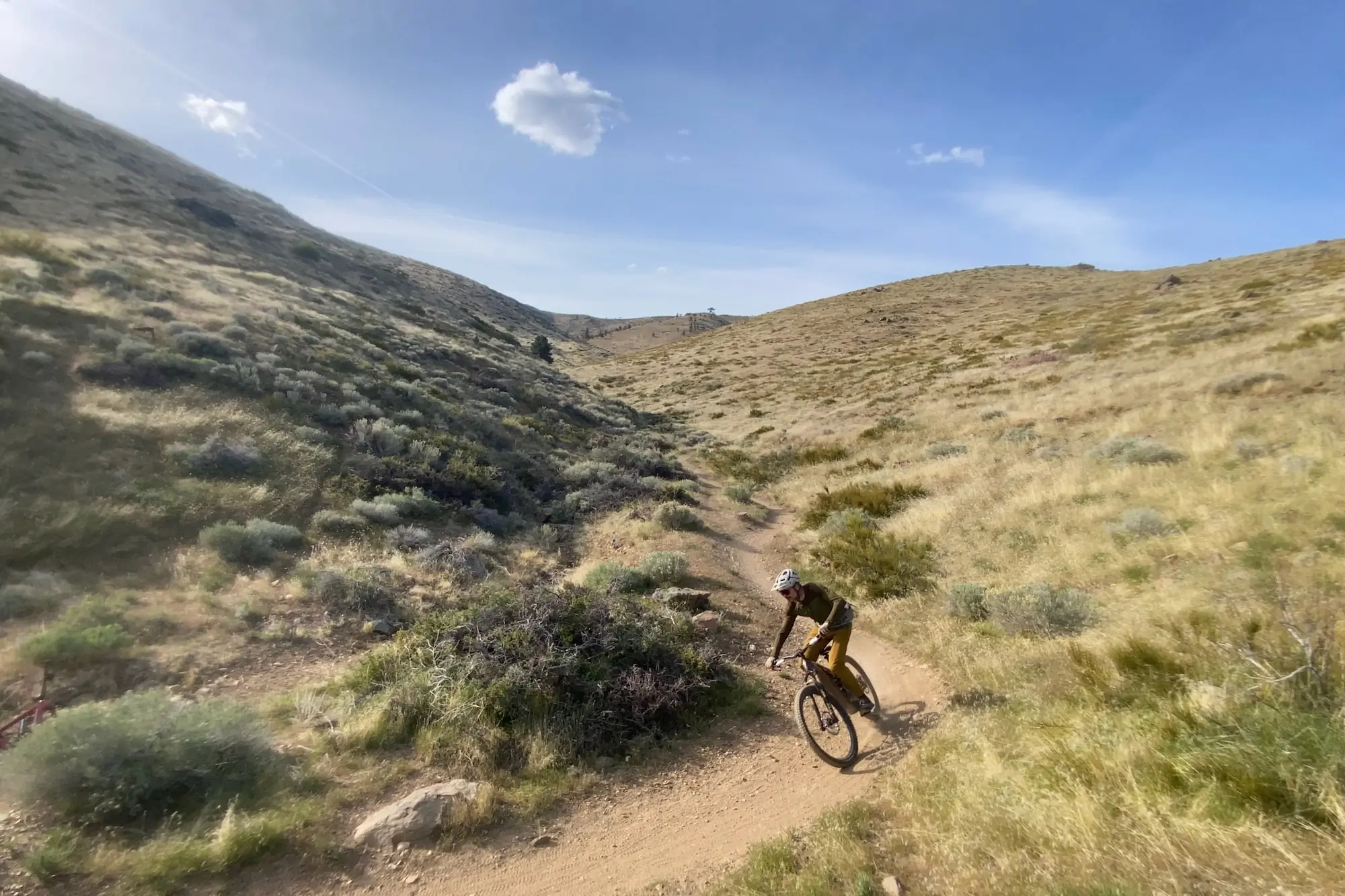 Riding the Turbo Levo 4 down a smooth, mellow trail in the high desert.