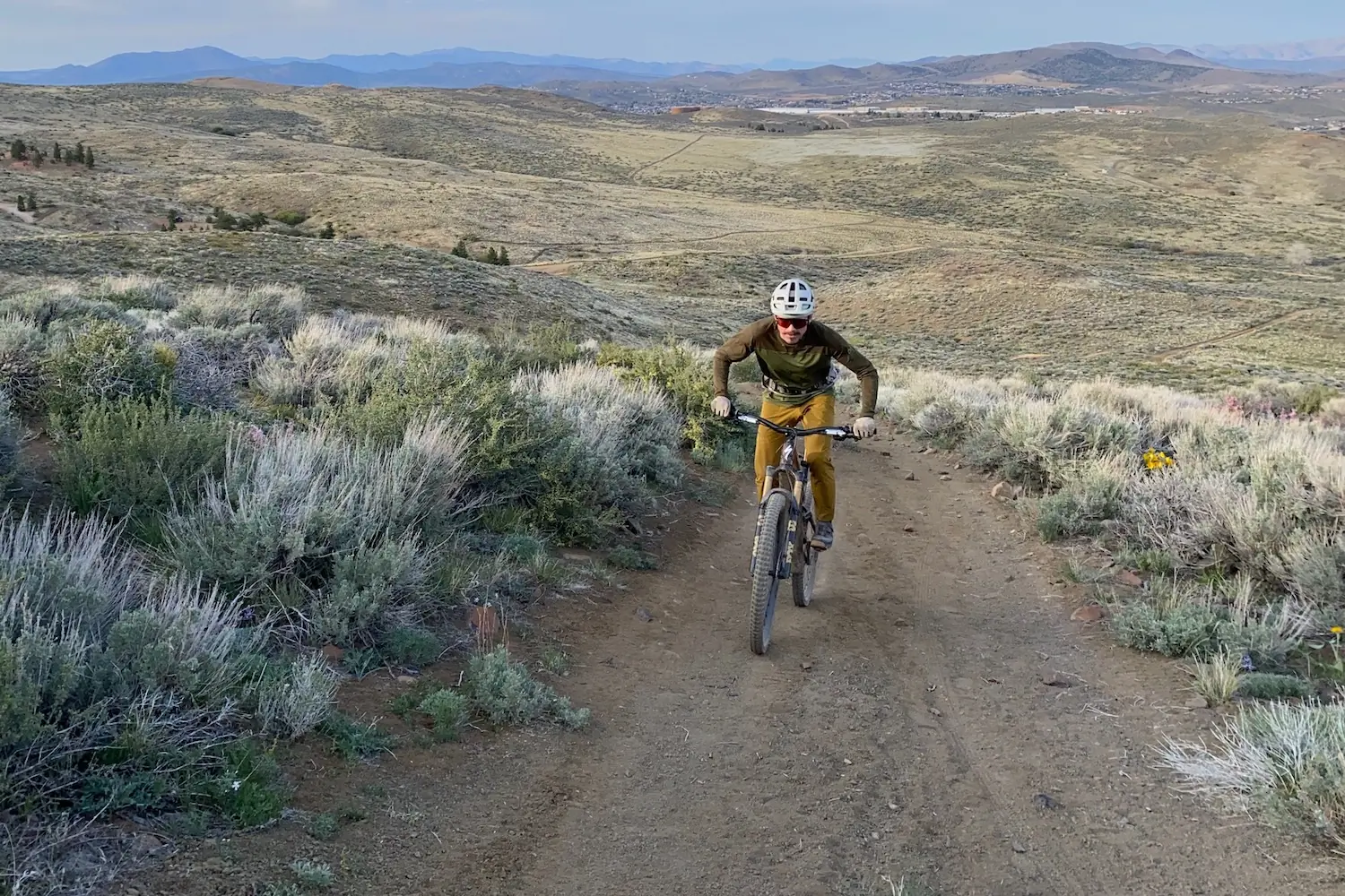 climbing a steep fire road with loose dirt on the Turbo Levo