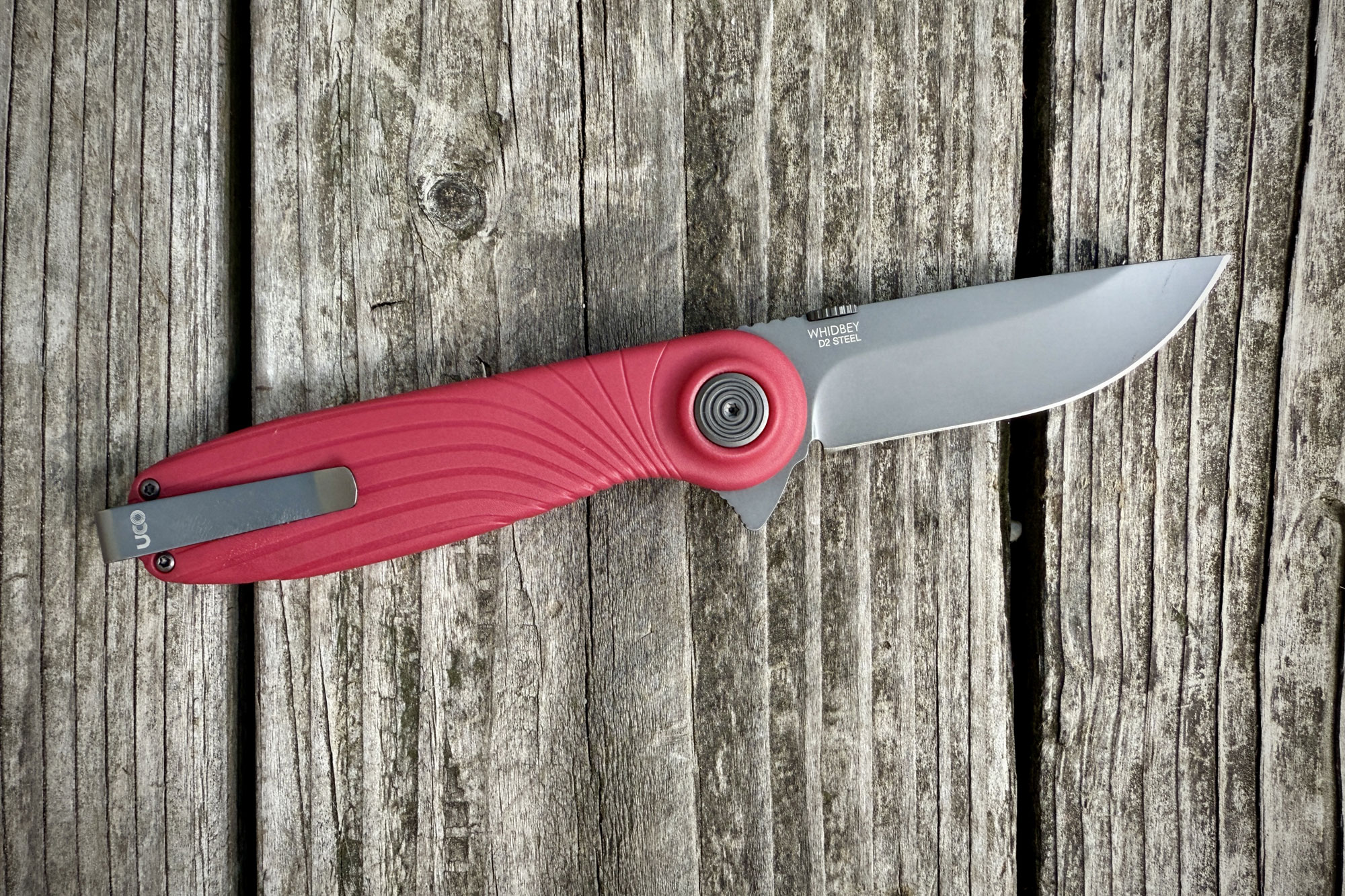 UCO Whidbey Pushfold on a wooden background