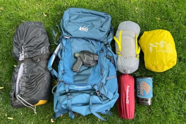 Backpacking With a Gun? The Pros and Cons — And Why I’m Weighing Them
