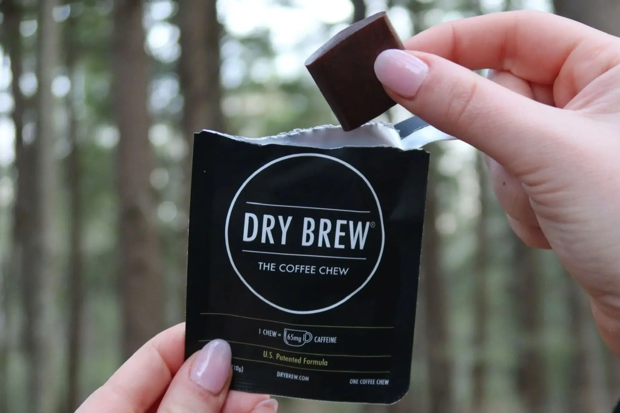 Person holding single-serving of Dry Brew Coffee