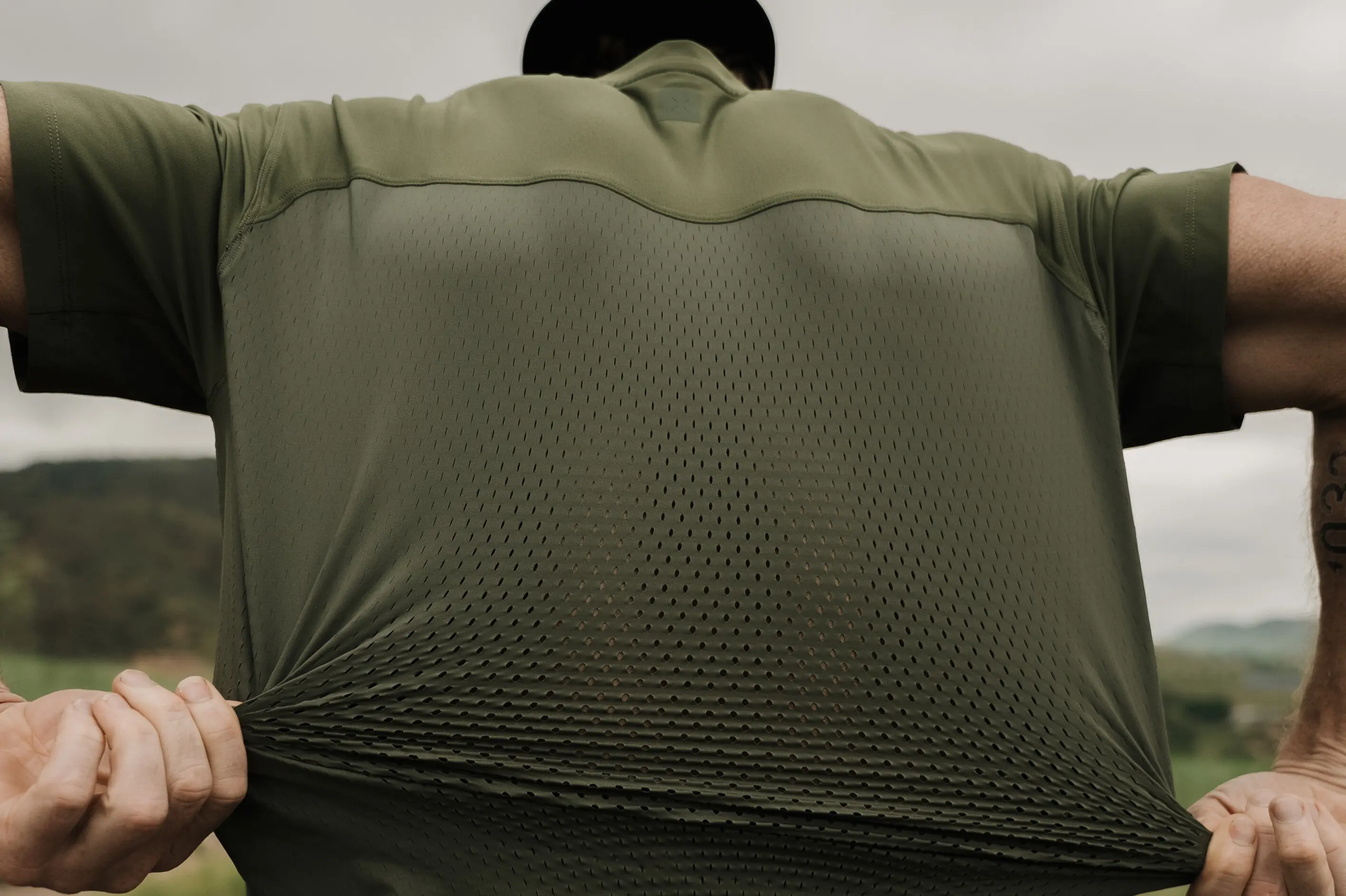 Man wearing Ten Thousand Tactical Recon Shirt in green