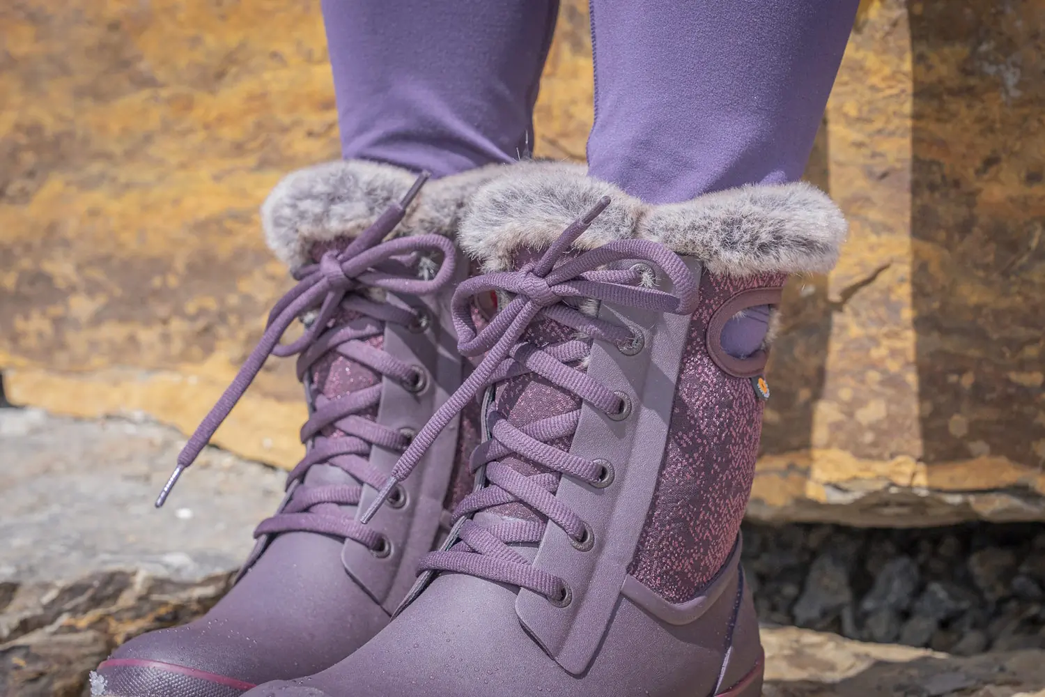 Close-up of Bogs Arcata Faded women's winter boots with faux fur lining and lace-up design