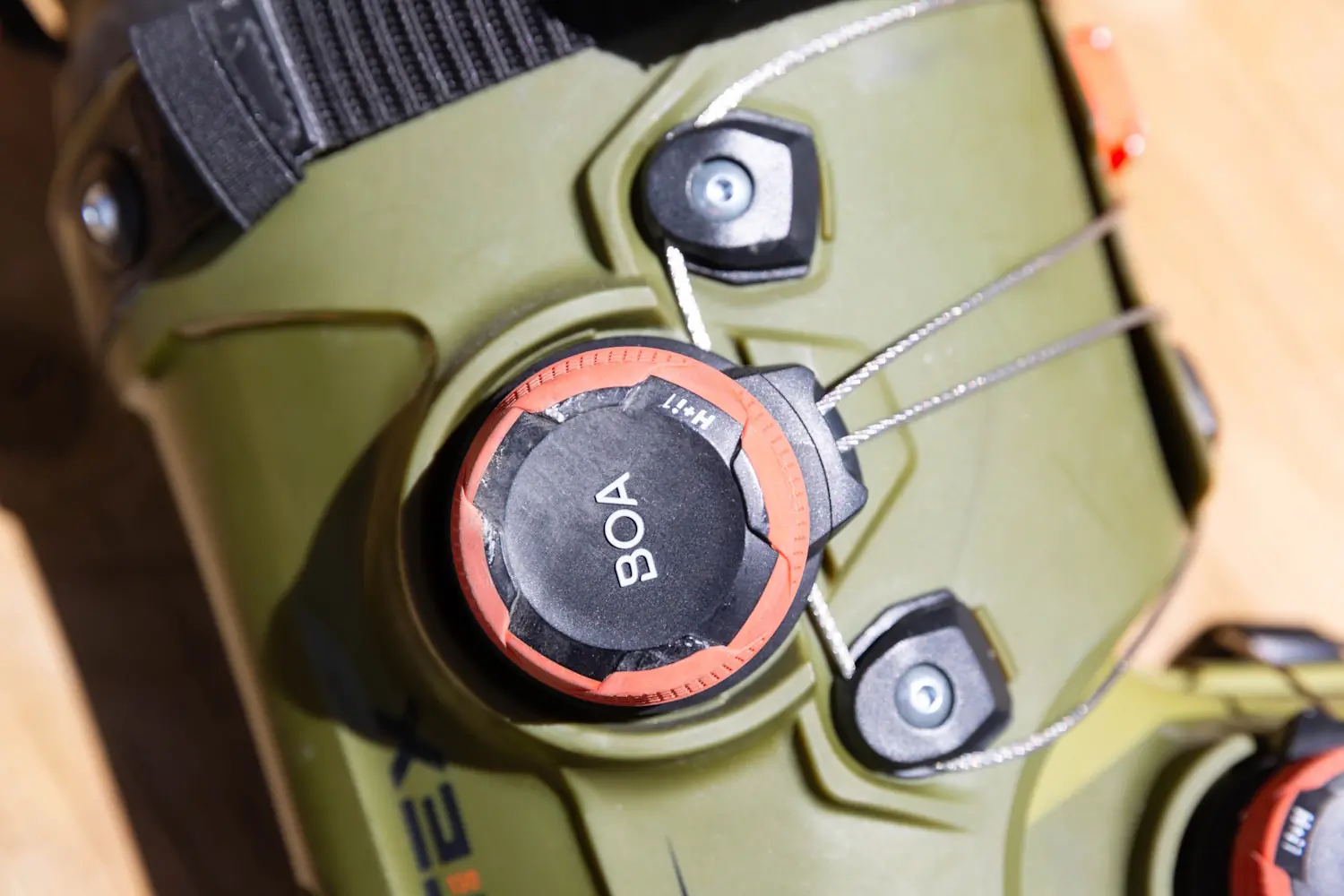 view of the H+i1 BOA dial on the K2 Cortex 130 ski boot, highlighting the micro-adjustable fit and dual-zone cable system