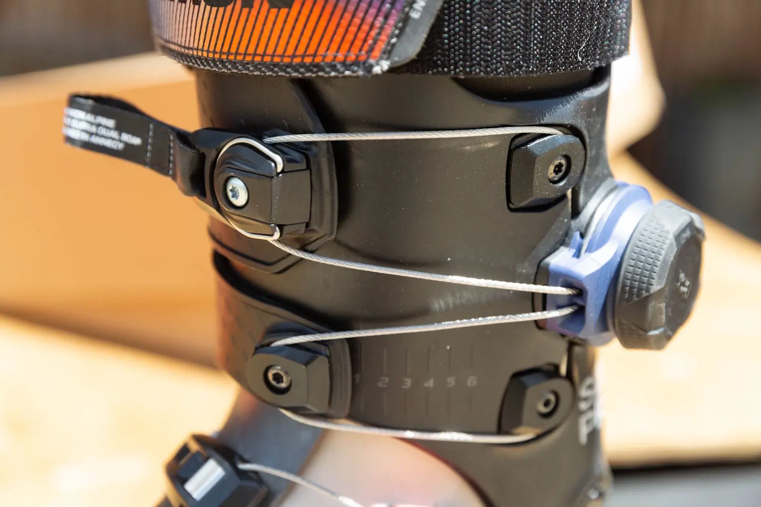 Close-up of the BOA fit system and cable dial on the Salomon S/Pro Supra 120 Ski Boots.