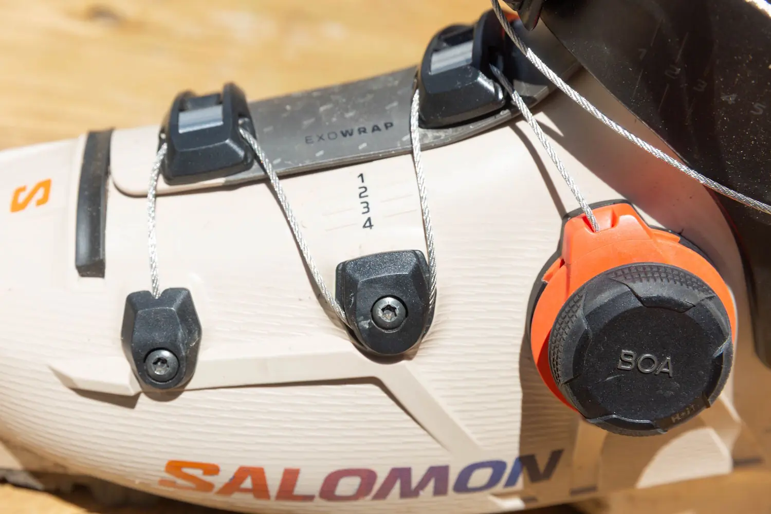 Close-up of the lower BOA Fit System and ExoWrap cable layout on the Salomon S/Pro Supra 120 Ski Boots.